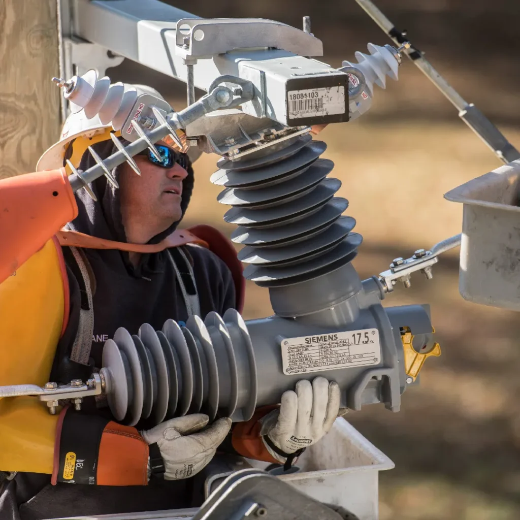 Person working on CMR compact modular recloser intallation