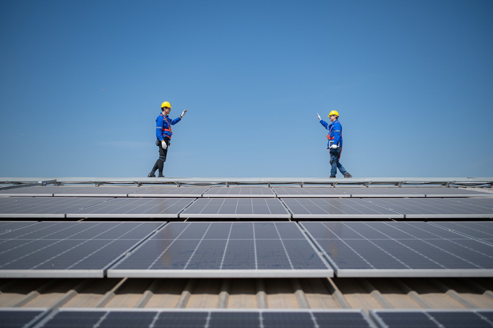 Both of technician working on a photovoltaic solar panels